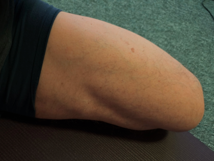 a leg bent back in half saddle pose on a yoga mat